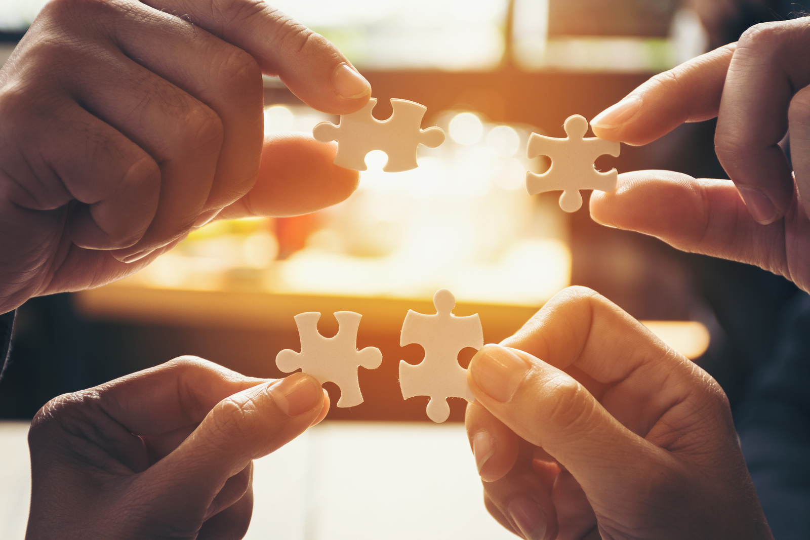 Team Hand Power Full  Hand Placing The  Jigsaw Puzzle Piece For